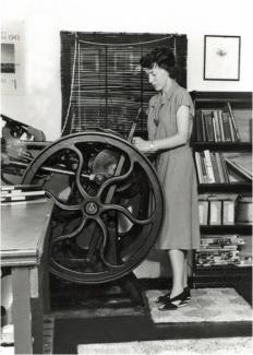 King Library Press founder Carolyn Reading Hammer operating a Chandler & Price press