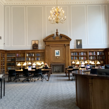 View of the Breckinridge Research Room, showing reference desk, bookshelves, and tables.