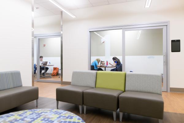 Students using private study rooms at the Medical Center Library.