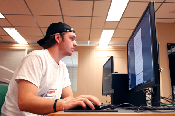 Student uses a computer terminal to request materials pick up at the Science & Engineering Library.