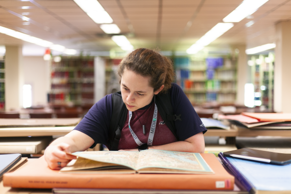 A student uses the map collection on the Fourth Floor of the Science & Engineering Library.