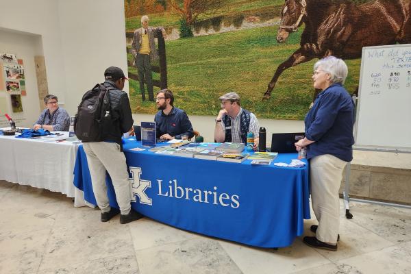 UK Librarians tabling at an event showcasing open access resources