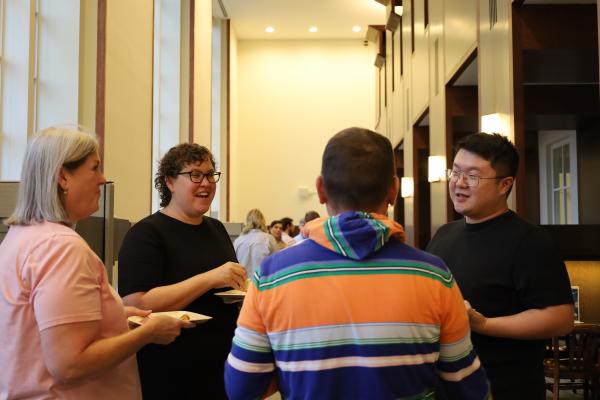 Librarians and faculty talking in a small group