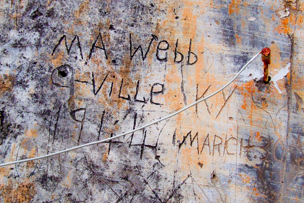 Graffiti from a stone wall in Italy reads "M. A. Webb C-Ville KY"