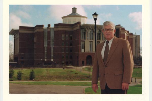 Paul Willis standing in front of the newly completed William T. Young Library.