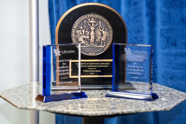 Medallion for Intellectual Achievement along with trophies for the Dean's Award for Excellence in Undergraduate Scholarship.