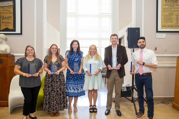 The winners of the 2025 Clements Award stand in the Great Hall