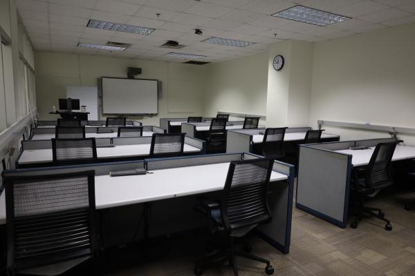 Desks, projector, and lectern in the Medical Center Library Instruction Room.