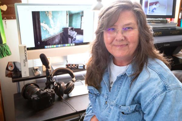 Kopana Terry sits in front of her home computer