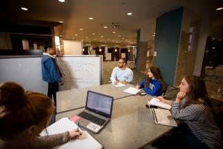 Students work on a group assignment in the Basement of Young Library.