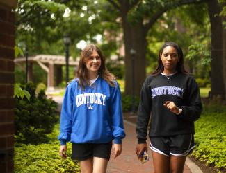 Two students walk near the President's house on the University of Kentucky Campus.