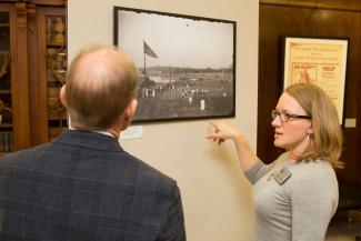 UK Libraries faculty member shows historic image to President Capilouto.