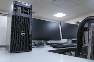 Two monitors and a computer tower