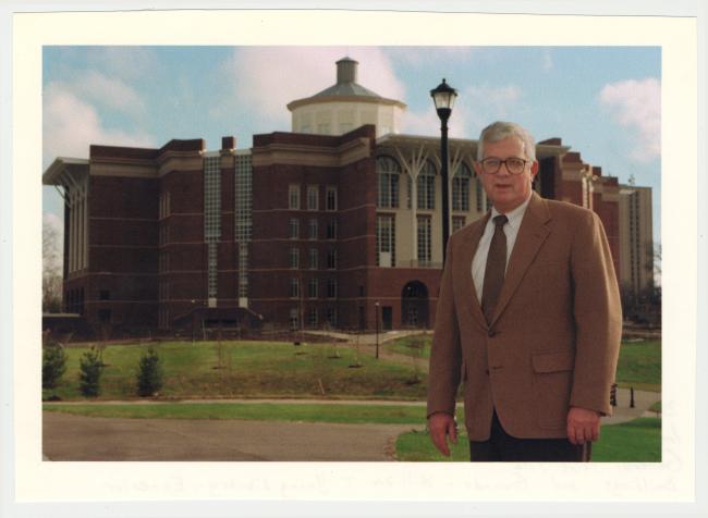 Paul Willis standing in front of the newly completed William T. Young Library.