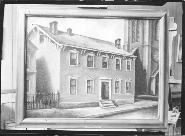 An archival photograph of a framed painting of a house