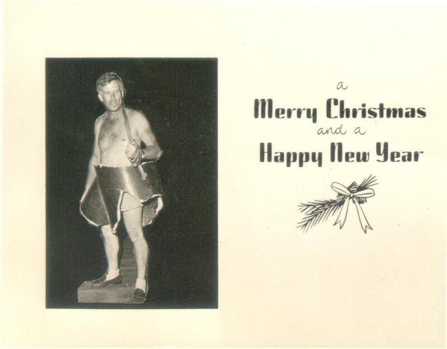 A Christmas card picturing an adult man in a costume