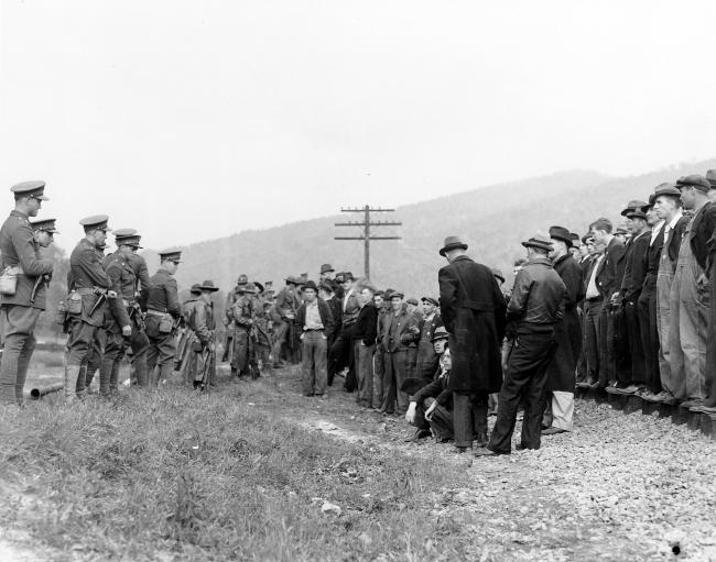 The National Guard faces off against miners gathered on a railroad