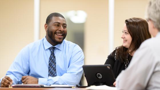 Staff members meet in the Medical Center Library.