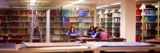 Students study at a table on the Fourth Floor of the Science & Engineering Library.