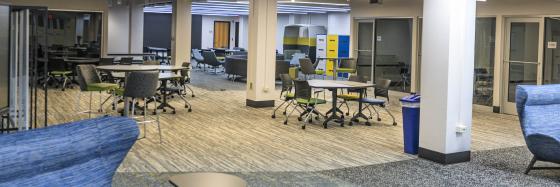 Tables, chairs, and other seating options in open space