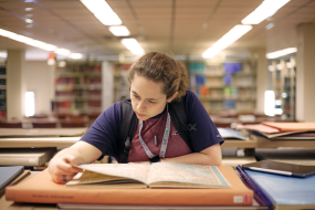 Student browsing collections at the King Library Annex.