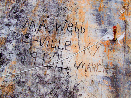 Graffiti from a stone wall in Italy reads "M. A. Webb C-Ville KY"