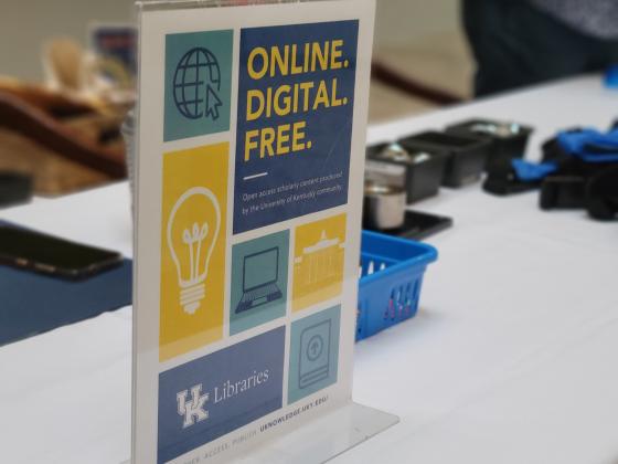 A sign on a table reads "Online. Digital. Free."