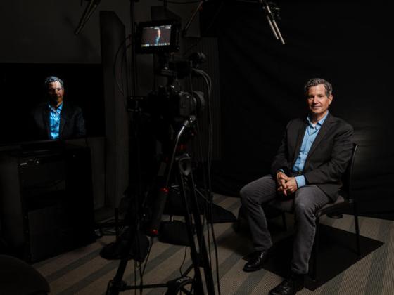 Nunn Center Director Doug Boyd in front of a camera in the Nunn Center recording studio