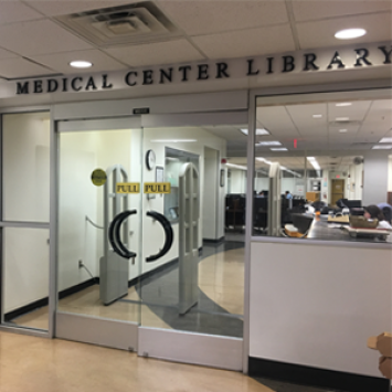 View of glass doors at entry of the Medical Center Library.