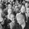 A large group of Synanon members with shaved heads