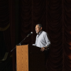 Author Percival Everett stands at a podium at the Kentucky Theater